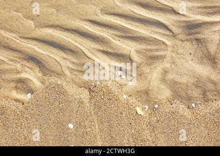 Wavy sea sand background on the beach Stock Photo