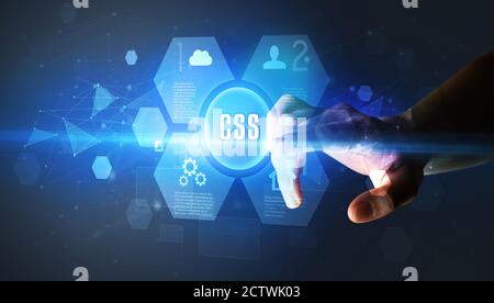 Hand touching CSS inscription, new technology concept Stock Photo - Alamy