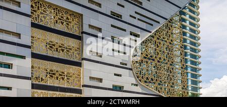 Exterior of Sabah Regional Library at Tanjung Aru Plaza, Kota Kinabalu, Malaysia, incorporating motifs of Sabah's ethnic communities into its design. Stock Photo