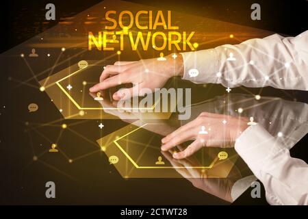 Navigating social networking with SOCIAL NETWORK inscription, new media concept Stock Photo