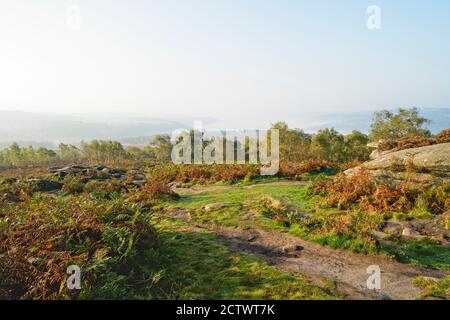 From high on the slopes of Surprise View, across a Derbyshire landscape shrouded in heavy autumn mist. Stock Photo