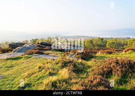 From high up on Surprise view, looking down on a mist covered Derbyshire Peak District autumn landscape. Stock Photo