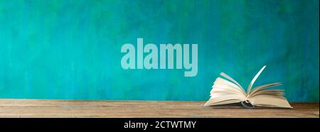 Ray of light shining on a book, education, knowledge,reading concept, panoramic, large copy space Stock Photo