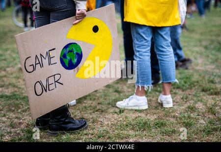 25 September 2020, Baden-Wuerttemberg, Stuttgart: ''Game Over'' is written on the poster of a participant in the global climate strike of the climate protection movement Fridays for Future. The climate movement Fridays for Future has called for a worldwide day of action after months of protests mainly on the internet. Photo: Christoph Schmidt/dpa Stock Photo