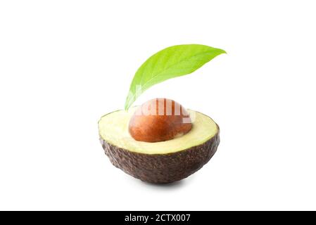 Half of fresh Hass avocado with leaves isolated on white background. Clipping path Stock Photo