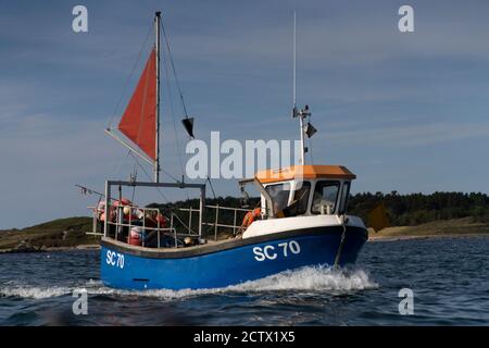 A fisherman holding two lobsters, Isles of Scilly. Stock Photo