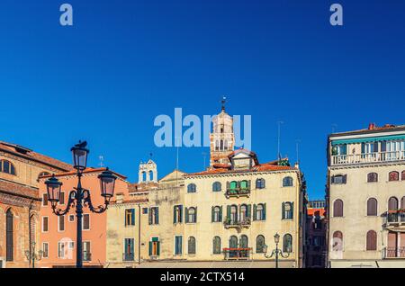 Campo Santo Stefano square with typical italian buildings of Venetian architecture and Santo Stefano Bell Tower in Venice historical city centre San Marco sestiere, Veneto region, Northern Italy Stock Photo