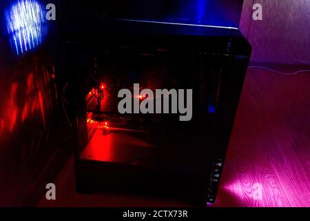 Modern system unit of a working computer with a glass side. Stock Photo