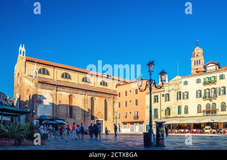 Venice, Italy, September 13, 2019: Campo Santo Stefano square with walking tourists people, Chiesa di Santo Stefano church with Bell Tower in historical city centre San Marco sestiere, Veneto region Stock Photo