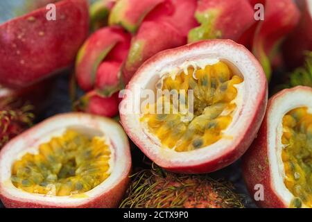 Ripe passion fruit so delicious sweet and sour. Close up on a half of passion fruit in macro concept. Tropical fruit. Stock Photo