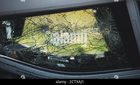 Shot of Broken Car Window after Horrific Traffic Accident. Vehicle Lying on its Roof after Collision. Stock Photo