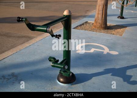 Outdoor gym with special equipment for sportive activity, rehabilitation for people with disability, in the public park in Limassol, Cyprus. Stock Photo