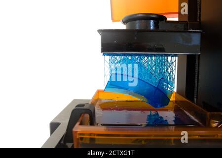 3D printing process. Modern 3D print technology. Working 3d printer machine printing a detail. Close-up. Stock Photo