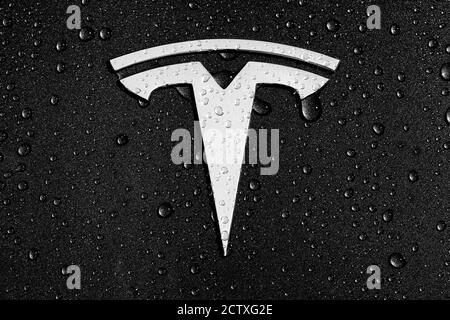 Tesla T Badge Logo Decal Or Emblem On The Hood Bonnet Of A Model 3 In Green With Rain Raindrops Or Dew Stock Photo Alamy