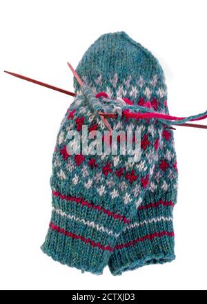 Scandinavian inspired knitted stranded colorwork used in making mittens. Stock Photo