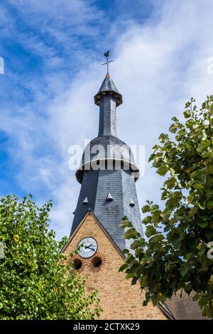 Slated ornate spire of the village church of Saint-Germain-Beaupré, Creuse (23), France. Stock Photo