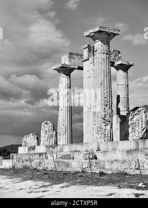 Ancient columns of temple of Aphaea in Aegina Island, Greece. Masterpiece of ancient greek architecture. Black and white photography Stock Photo