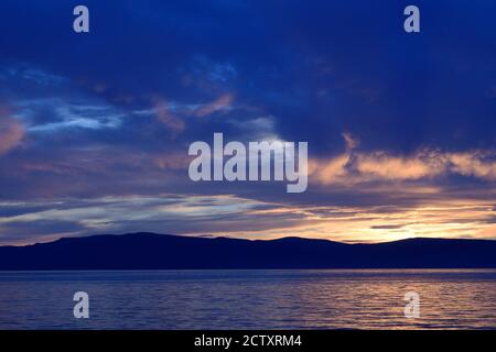 Purple Fantasy Sunset Over Lake Baikal (Listvyanka, Russia) Stock Photo
