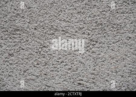 Facade plaster background. Single-ply monolithic plaster decorative background. Stock Photo