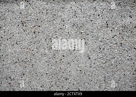 Facade plaster background. Single-ply monolithic plaster decorative background. Stock Photo
