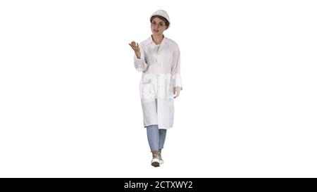 Young female engineer or architect making presenting gestures an Stock Photo