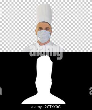 Male chef cook wearing face protective medical mask for protecti Stock Photo