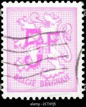 Saint Petersburg, Russia - September 18, 2020: Stamp printed in the Belgium the image of the Number on Heraldic Lion, circa 1980 Stock Photo