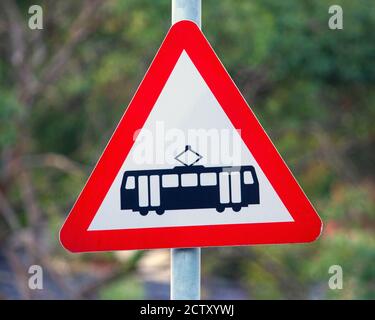 A sign at a Tram crossing - which is known as the Great Orme Tramway, in the seaside town of Llandudno in North Wales, UK. Stock Photo