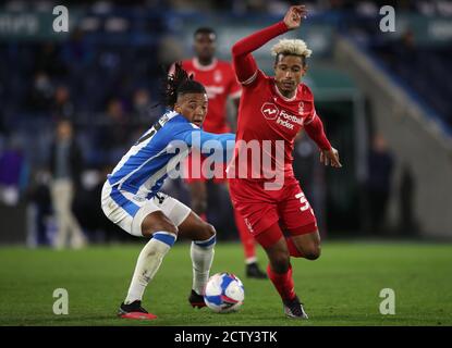 Huddersfield Town's Romoney Crichlow-Noble pulls back on Nottingham Forest's Lyle Taylor during the Sky Bet Championship match at the John Smith's Stadium, Huddersfield. Picture date: Friday September 25, 2020. See PA story SOCCER Huddersfield. Photo credit should read: Nick Potts/PA Wire. EDITORIAL USE ONLY No use with unauthorised audio, video, data, fixture lists, club/league logos or 'live' services. Online in-match use limited to 120 images, no video emulation. No use in betting, games or single club/league/player publications. Stock Photo