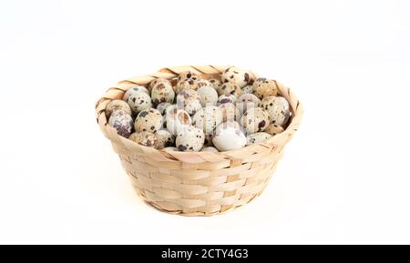 quail eggs inside the basket on white background Stock Photo