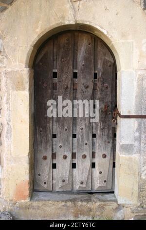 Old wooden door at medieval time church in Romania Stock Photo