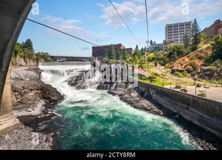 The Riverfront Park sky ride gondola ride travels over the Spokane River and Falls in Spokane, Washington. Stock Photo