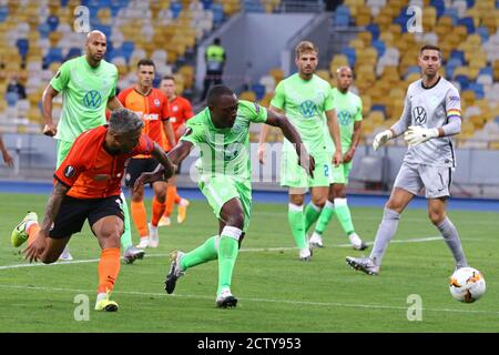 KYIV, UKRAINE - AUGUST 5, 2020: Marlos of Shakhtar Donetsk (L) fights for a ball with Jerome Roussillon of VfL Wolfsburg during their UEFA Europa League game at NSC Olimpiyskyi stadium in Kyiv Stock Photo