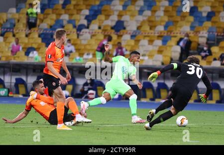 KYIV, UKRAINE - AUGUST 5, 2020: Shakhtar Donetsk (in Orange) and VfL Wolfsburg (in Green) players fight for a ball during their UEFA Europa League game at NSC Olimpiyskyi stadium in Kyiv, Ukraine Stock Photo