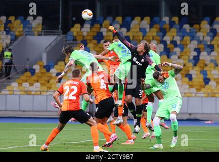 KYIV, UKRAINE - AUGUST 5, 2020: Shakhtar Donetsk (in Orange) and VfL Wolfsburg (in Green) players fight for a ball during their UEFA Europa League game at NSC Olimpiyskyi stadium in Kyiv, Ukraine Stock Photo