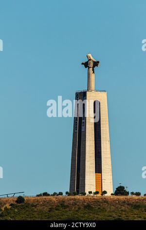 Lisbon, Portugal 07/12/2010: A portrait photo of the famous Christ the King statue located on a hilltop in Almada overlooking Lisbon across Tagus Rive Stock Photo