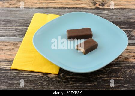 Chocolate Bar With A Missing Bite On White Background Stock Photo