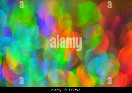 Shiny abstract background with festive defocused lights, colorful bokeh. Christmas or New Year holiday concept. Stock Photo
