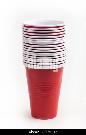 Stacked Red plastic cups isolated over white background Stock Photo