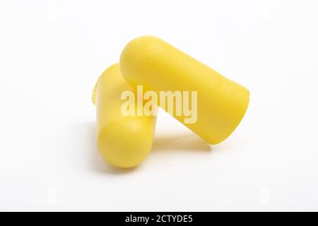 Yellow Ear plugs isolated on a white background Stock Photo