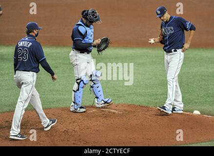 Tampa Bay Rays pitching coach Kyle Snyder, left, looks on as Shane