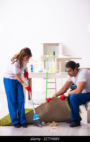 Young pair doing housework at the home Stock Photo