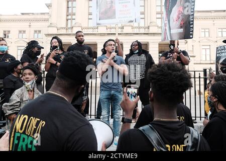 Atlanta, Georgia, USA. 27th Mar, 2021. Atlanta City Council member Antonio  Brown speaks to a group of demonstrators at a rally outside of Atlanta City  Hall in support of Georgia State Representative