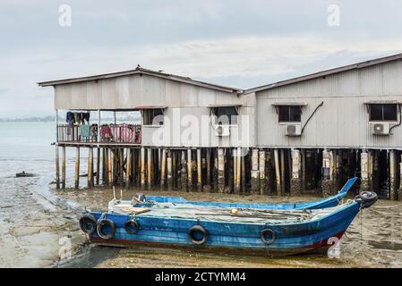 George Town, Penang, Malaysia - December 1, 2019: Typical stilt house in one of the Clan Jetties in historic George Town, Penang, Malaysia. Moored woo Stock Photo