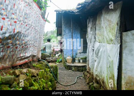 A rural house made of bricks and mud in India with many people living together. India Kerala Tamil Nadu  street life photography. Stock Photo