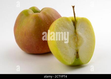 whole and sliced apples on a white background Stock Photo