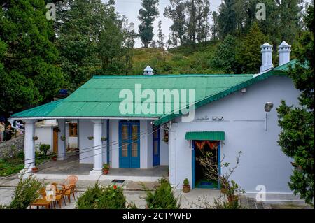 26 Sep 2009 Vintage Small Colonial style old House with Tin roof and stone chimney roof Nainital Uttarakhand India Stock Photo