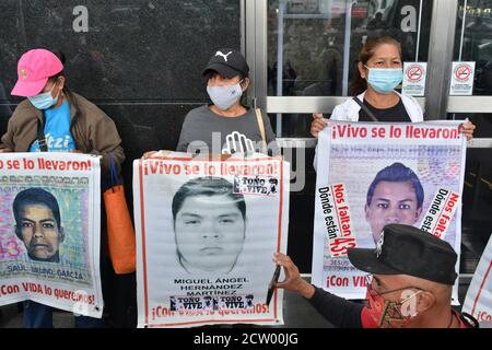 Mexico City, Mexico. 25th Sep, 2020. MEXICO CITY, MEXICO - SEPTEMBER 25: A person joins a protest to commemorate the 6th anniversary of the 43 students of normal school who disappeared on September 26, 2014. Relatives of the 43 students of Ayotzinapa during a demonstration outside of at General Prosecutor of the Republic to demand justice for the 43 students of the 'Raul Isidro Burgos' Rural Normal School of Ayotzinapanon September 25, 2020 in Mexico City, Mexico. Credit: Carlos Tischler/Eyepix Group/The Photo Access Credit: The Photo Access/Alamy Live News Stock Photo