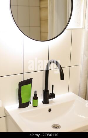 Doy pack and spray bottle with green space for your brand in bathroom. Stock Photo