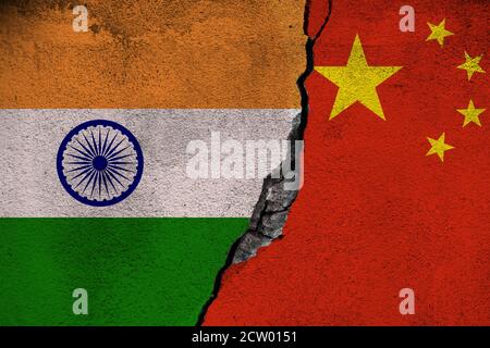 Concept of the Conflict between India and China with painted Flags on a Wall and a Crack between them Stock Photo